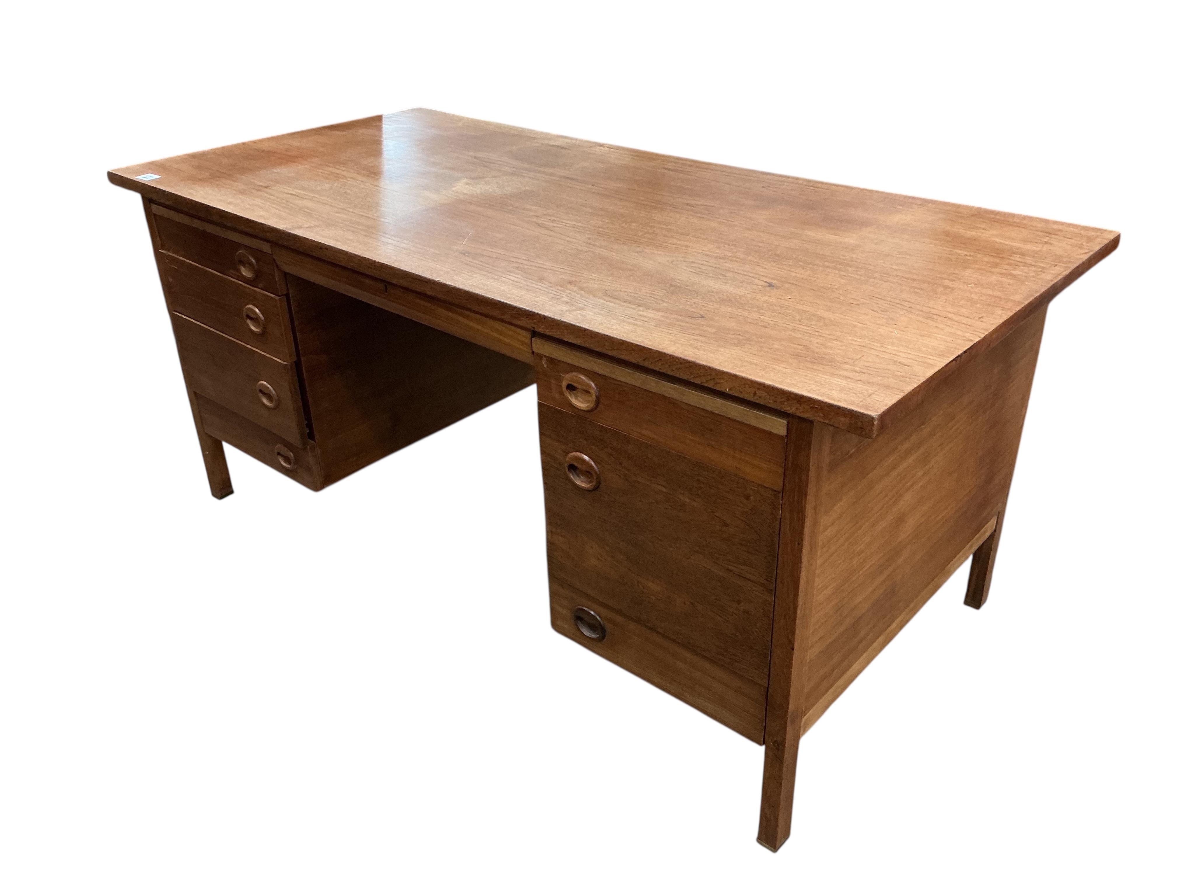 A mid century teak kneehole desk, width 160cm, depth 81cm, height 75cm